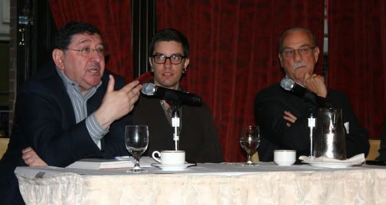 David Maister addresses a question from the audience while Julien and Charlie listen enraptured.